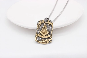 Macro view of Freemason symbol engraving on a two-tone steel military dog tag necklace