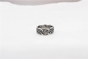 Detail of vintage silver titanium steel ring with Celtic knot and music note patterns