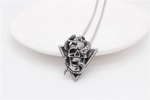 Detailed view of gothic skull and snake pendant necklace in retro stainless steel