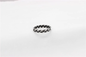 Detailed view of vintage silver viking ring featuring a classic braided rope texture