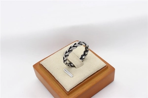 Macro detail of retro viking twisted braid ring in oxidized silver finish for men