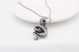 Detailed view of vintage snake pendant with intricate scales on titanium steel chain