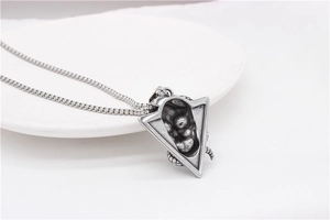 Detailed view of silver triangle pendant with industrial texture and sturdy box chain