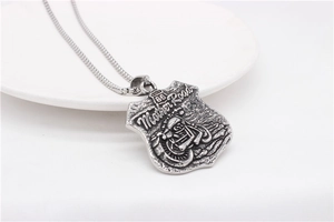Detail of Route 66 shield pendant with embossed motorcycle on steel chain