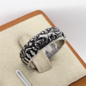 Vintage wolf ring in silver steel with embossed forest and mountain landscape