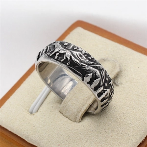 Vintage stainless steel ring for men featuring embossed wolf and mountain landscape scenery