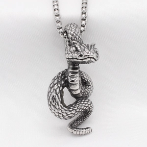 Vintage stainless steel snake pendant necklace with detailed scales on a silver box chain