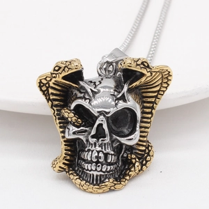Gothic punk necklace featuring a silver skull and golden king cobra snakes pendant