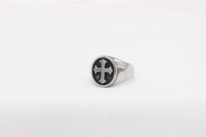Macro detail of retro stainless steel ring with black Celtic cross design for men