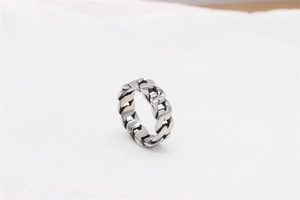 Detail view of antique silver Cuban link chain ring featuring vintage industrial style
