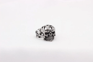 Macro view of gothic skull ring with oxidized vintage finish and detailed carvings