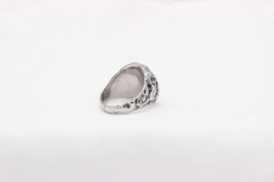 Macro detail of vintage Viking style ring showing unique irregular lava rock texture