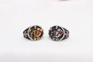 Detail of vintage silver Knight Templar shield ring with red cross enamel emblems
