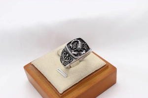 Detailed view of vintage scorpion totem engraving on polished men's stainless steel ring