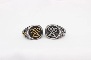 Macro detail of vintage Viking rings with gold and silver engraved mystic symbols