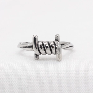 Vintage industrial barbed wire knot ring for men made of polished silver stainless steel