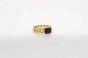 Close-up of golden Cuban link chain ring featuring a rectangular black onyx gemstone
