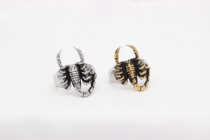 Detailed view of silver and black gold gothic scorpion rings made of titanium steel