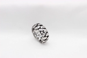 Detailed view of heavy vintage silver chain pattern on a wide stainless steel men's ring