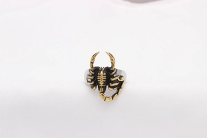 Detailed view of vintage scorpion relief design on men's stainless steel ring