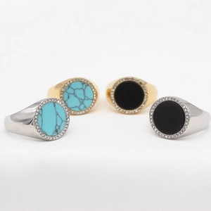 Minimalist round gemstone rings in gold and silver with turquoise and black onyx stones