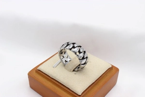 Detailed view of silver cuban chain link ring with vintage black oxidation finish