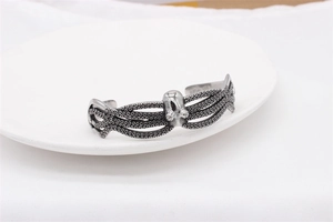 Macro detail of retro stainless steel octopus bracelet featuring textured tentacles