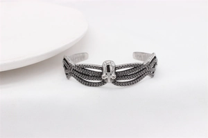 Macro detail of vintage silver octopus cuff bracelet with intricate tentacle suction cups