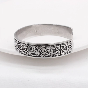 Retro Viking stainless steel cuff bracelet with intricate Celtic dragon pattern carvings