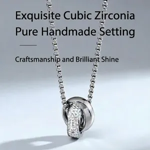 Double-ring pendant necklace in titanium steel with shimmering cubic zirconia pavé setting
