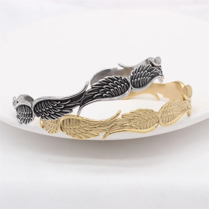 Bracciali aperti retrò a forma di piuma da uomo in argento antico e oro