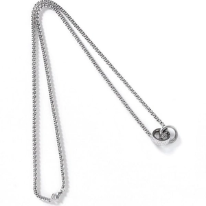 Detailed close-up of a silver box chain with double interlocking rings and crystal inlay