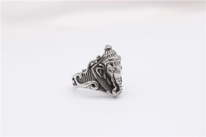 Macro shot of Ganesha relief ring in vintage stainless steel with oxidized finish details