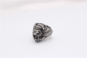 Macro shot of retro eagle relief detail and wing texture on vintage steel ring