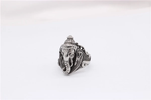 Close-up of vintage steel Ganesha ring with detailed elephant carvings and silver finish