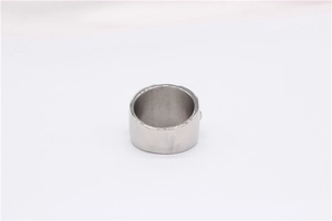 Detail shot of the smooth polished inner band and embossed texture of the skull ring