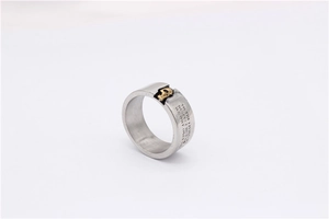 Detailed macro view of vintage titanium steel ring with gold relief and engraved quotes