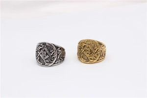Detailed relief of Masonic G symbol on vintage silver and gold stainless steel rings