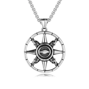 Macro view of vintage silver All-Seeing Eye pendant on a sturdy stainless steel box chain