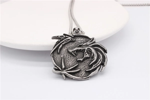 Macro detail of retro stainless steel wolf head pendant with antique silver finish