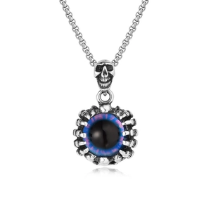 Detailed close-up of a punk style skull pendant with a claw-held blue evil eye