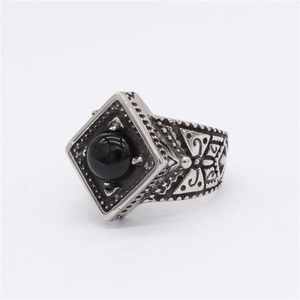 Vintage stainless steel ring with black round gemstone and engraved geometric patterns