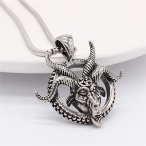 Vintage silver ram head pendant necklace with pentagram detail in gothic punk style