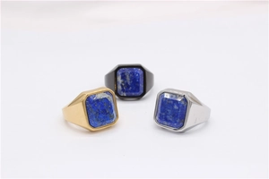 Three men's titanium steel rings in gold, silver and black with square blue gemstones