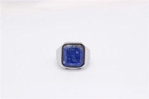 Macro detail of men's titanium steel ring featuring a square-cut deep blue lapis lazuli stone