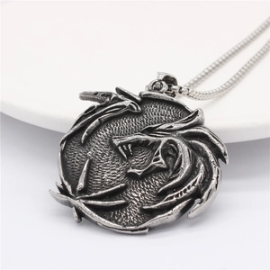 Vintage oxidized stainless steel dragon pendant necklace with detailed relief on snake chain
