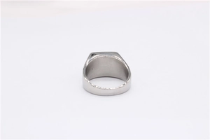 Macro detail of silver titanium steel ring featuring vintage Great Wall pattern texture