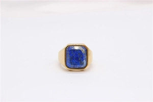 Macro shot of rectangular lapis lazuli stone set in a gold plated signet ring
