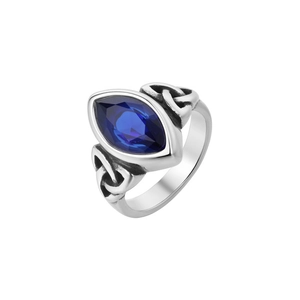 Macro detail of marquise cut blue sapphire gemstone and Celtic knot silver ring band