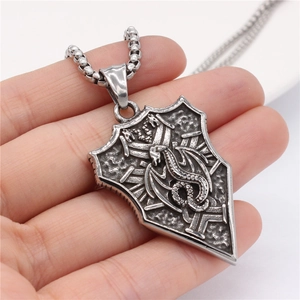 Vintage stainless steel shield pendant necklace featuring detailed dragon relief for men
